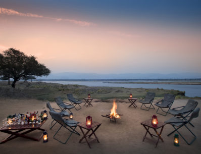 Zambezi Expeditions Mana Pools National Park Zimbabwe Safari Tented Camp African Bush Camps around fire at sunset